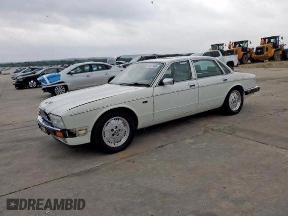 1994 Jaguar XJ with VIN SAJKX1743RC698636, listed as a Copart auction lot 56376685 with 192,928 mi miles and Salvage title. Bid and sale history available at DreamBid. Image 1.