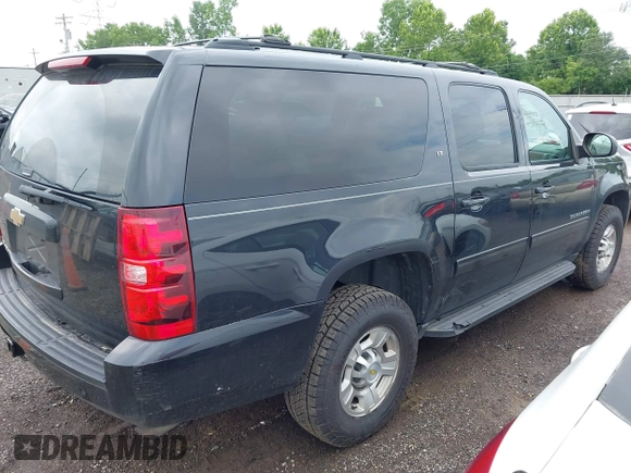 2011 Chevrolet Suburban with VIN 1GNWKMEG1BR374950, listed as a IAAI auction lot 42781182 with 304,690 mi miles and . Bid and sale history available at DreamBid. Image 4.