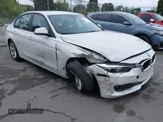 2015 BMW 3 Series 320i with VIN WBA3B1C5XFK137171, listed as a IAAI auction lot 41736278 with 28,673 mi miles. Bid and sale history available at carsss.com. Image 1.