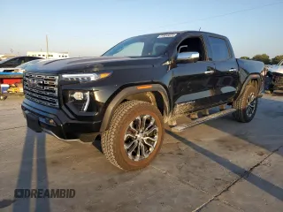 2023 GMC Canyon 4WD Denali with VIN 1GTP6FEK8P1164692, listed as a Copart auction lot 77033234 with 5,644 mi miles and Salvage Title. Bid and sale history available at carsss.com. Image 1.