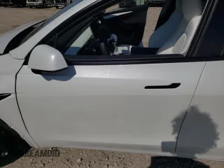 2023 Tesla Model Y Long Range with VIN 7SAYGDEE6PF861451, listed as a Copart auction lot 53133854 with 7,216 mi miles and Salvage Title. Bid and sale history available at DreamBid. Image 7.