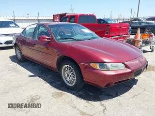 2000 Pontiac Grand Prix SE with VIN 1G2WJ52K3YF262773, listed as a IAAI auction lot 42031719 with 164,284 mi miles. Bid and sale history available at carsss.com. Image 1.