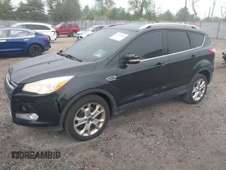 2014 Ford Escape Titanium with VIN 1FMCU9J90EUC24898, listed as a IAAI auction lot 42166523 with 152,464 mi miles and . Bid and sale history available at DreamBid. Image 2.