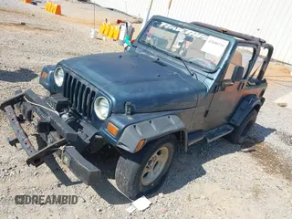 1998 Jeep Wrangler Sport with VIN 1J4FY19S2WP710055, listed as a IAAI auction lot 42680216 with Not provided miles and . Bid and sale history available at DreamBid. Image 2.