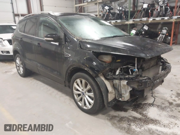 2017 Ford Escape Titanium with VIN 1FMCU9J9XHUB51401, listed as a IAAI auction lot 41025642 with 77,908 mi miles. Bid and sale history available at carsss.com. Image 1.
