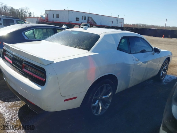 2015 Dodge Challenger SXT Plus with VIN 2C3CDZBG9FH811580, listed as a IAAI auction lot 41813822 with 134,997 mi miles. Bid and sale history available at carsss.com. Image 4.