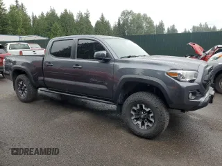 2020 Toyota Tacoma SR5 with VIN 3TMDZ5BN2LM097782, listed as a Copart auction lot 61573465 with 57,321 mi miles and Salvage title. Bid and sale history available at DreamBid. Image 4.