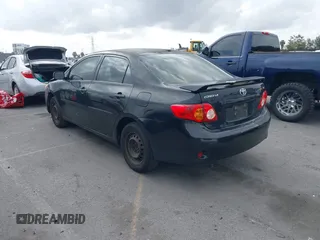 2009 Toyota Corolla with VIN 1NXBU40E59Z093650, listed as a IAAI auction lot 42121575 with 166,631 mi miles. Bid and sale history available at carsss.com. Image 3.