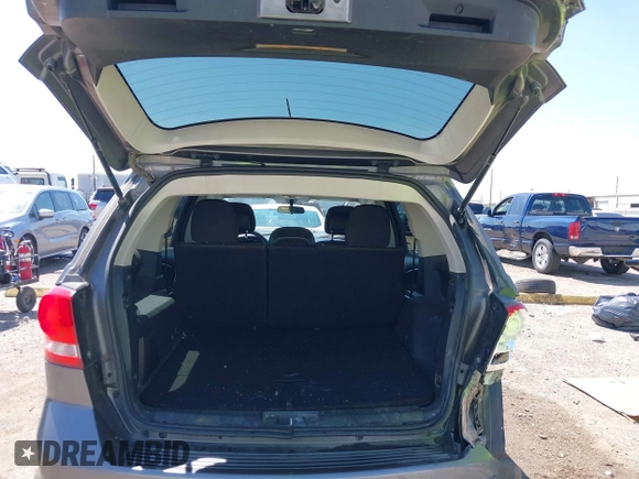 2013 Dodge Journey SXT with VIN 3C4PDDBGXDT650886, listed as a IAAI auction lot 41864331 with 224,579 mi miles and . Bid and sale history available at DreamBid. Image 17.