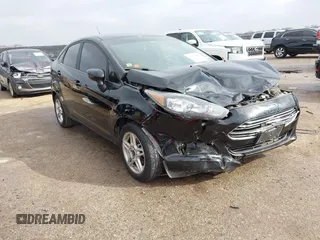 2019 Ford Fiesta SE z VIN 3FADP4BJ7KM158142, wystawiony jako IAAI lot #41510806 z przebiegiem 55 315 mil mil oraz . Historia ofert i sprzedaży dostępna na DreamBid. Obrazek 1.
