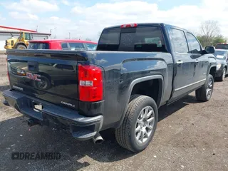 2014 GMC Sierra 1500 Denali z VIN 3GTU2WEC6EG401458, wystawiony jako IAAI lot #41935704 z przebiegiem 149 136 mil mil oraz . Historia ofert i sprzedaży dostępna na DreamBid. Obrazek 4.