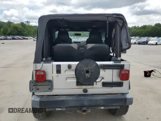 2005 Jeep Wrangler X with VIN 1J4FA39S55P353789, listed as a Copart auction lot 62469015 with 143,817 mi miles and Salvage title. Bid and sale history available at DreamBid. Image 6.