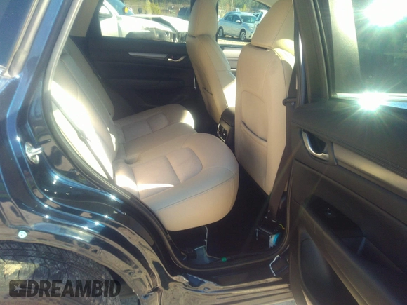2020 Mazda CX-5 Touring with VIN JM3KFACM1L1817303, listed as a IAAI auction lot 41627859 with 57,268 mi miles. Bid and sale history available at carsss.com. Image 8.