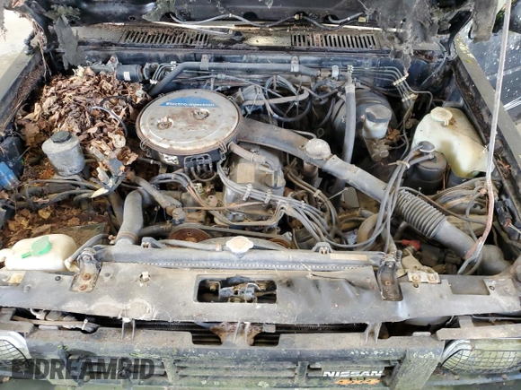 1986 Nissan Hardbody E z VIN 1N6ND16Y7GC413942, wystawiony jako Copart lot #57677605 z przebiegiem 126 183 mil mil oraz Tytuł czysty. Historia ofert i sprzedaży dostępna na DreamBid. Obrazek 11.