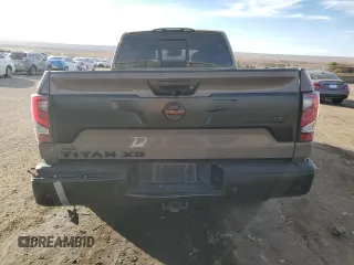 2021 Nissan Titan SV z VIN 1N6AA1FB9MN533034, wystawiony jako Copart lot #81335494 z przebiegiem 71 281 mil mil oraz Szkoda całkowita • Salvage title. Historia ofert i sprzedaży dostępna na DreamBid. Obrazek 6.