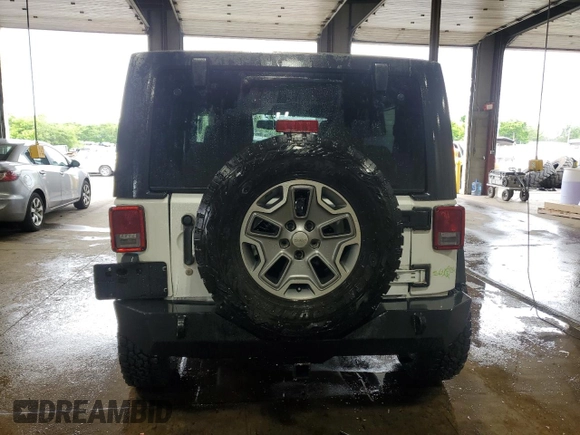 2013 Jeep Wrangler Rubicon 10th Anniversary z VIN 1C4BJWCGXDL543958, wystawiony jako Copart lot #58492255 z przebiegiem 94 455 mil mil oraz Szkoda całkowita • Salvage title. Historia ofert i sprzedaży dostępna na DreamBid. Obrazek 6.