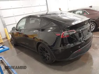 2021 Tesla Model Y Long Range with VIN 5YJYGAEE5MF305655, listed as a IAAI auction lot 41860993 with 50,750 mi miles. Bid and sale history available at carsss.com. Image 3.