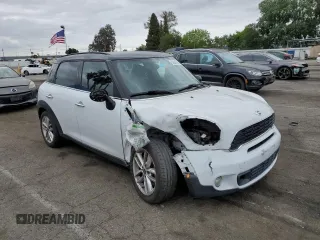 2013 MINI Countryman S with VIN WMWZC3C54DWP24877, listed as a Copart auction lot 53583655 with 97,734 mi miles and Salvage title. Bid and sale history available at DreamBid. Image 4.