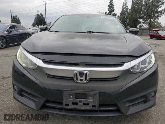 2016 Honda Civic EX-T z VIN 2HGFC1F33GH634029, wystawiony jako Copart lot #56026045 z przebiegiem 168 676 mil mil oraz Szkoda całkowita • Salvage title. Historia ofert i sprzedaży dostępna na DreamBid. Obrazek 5.