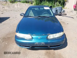 2003 Oldsmobile Alero GL1 z VIN 1G3NL52F53C153441, wystawiony jako IAAI lot #39799738 z przebiegiem 180 025 mil mil oraz . Historia ofert i sprzedaży dostępna na DreamBid. Obrazek 6.
