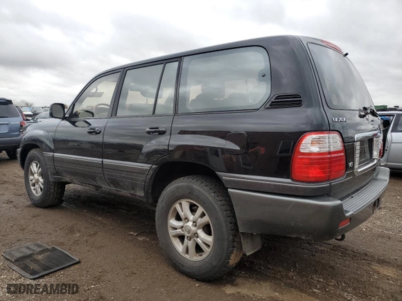 2003 Lexus LX 470 with VIN JTJHT00W333526380, listed as a Copart auction lot 77356534 with 151,636 mi miles and Salvage Title. Bid and sale history available at carsss.com. Image 2.