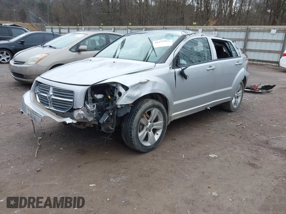 2010 Dodge Caliber SXT z VIN 1B3CB4HA1AD663892, wystawiony jako IAAI lot #41535071 z przebiegiem 186 900 mil mil oraz . Historia ofert i sprzedaży dostępna na DreamBid. Obrazek 2.