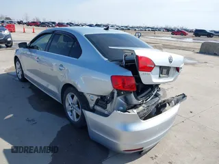 2014 Volkswagen Jetta TDI w/Premium with VIN 3VWLL7AJ6EM424935, listed as a IAAI auction lot 41533634 with 64,028 mi miles and . Bid and sale history available at DreamBid. Image 3.