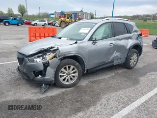2014 Mazda CX-5 Touring with VIN JM3KE4CY1E0426409, listed as a IAAI auction lot 41924258 with 116,956 mi miles. Bid and sale history available at carsss.com. Image 2.