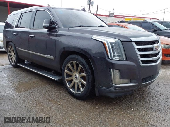 2015 Cadillac Escalade Premium z VIN 1GYS3NKJ5FR540221, wystawiony jako IAAI lot #41289989 z przebiegiem 100 191 mil mil oraz . Historia ofert i sprzedaży dostępna na DreamBid. Obrazek 1.