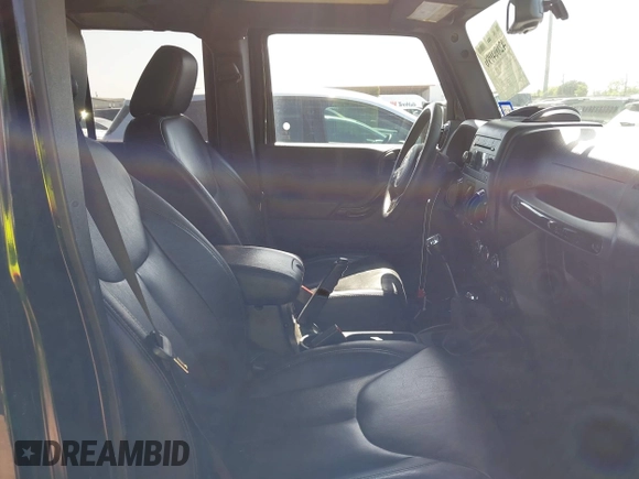 2015 Jeep Wrangler Unlimited Sahara with VIN 1C4BJWEG0FL717536, listed as a IAAI auction lot 42004096 with 90,802 mi miles and . Bid and sale history available at DreamBid. Image 5.