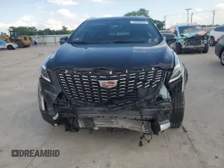 2021 Cadillac XT5 FWD Premium Luxury z VIN 1GYKNCR41MZ174477, wystawiony jako Copart lot #54335615 z przebiegiem 39 158 mil mil oraz Szkody całkowita. Historia ofert i sprzedaży dostępna na DreamBid. Obrazek 5.