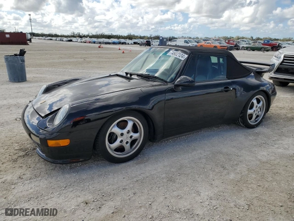 1997 Porsche 911 Carrera 4 with VIN WP0CA2992VS340477, listed as a Copart auction lot 74902124 with NaN miles and Salvage Title. Bid and sale history available at carsss.com. Image 1.