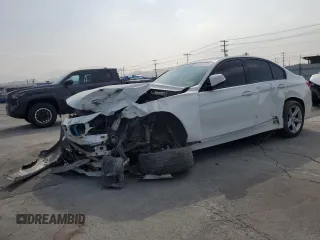 2015 BMW 3 Series 328i with VIN WBA3A5C56FF606517, listed as a Copart auction lot 59388115 with 185,684 mi miles and Salvage title. Bid and sale history available at DreamBid. Image 1.