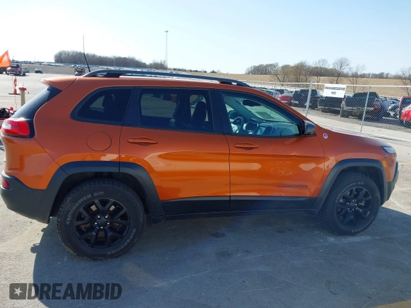 2016 Jeep Cherokee Trailhawk with VIN 1C4PJMBBXGW251682, listed as a IAAI auction lot 41973696 with 100,411 mi miles. Bid and sale history available at carsss.com. Image 14.
