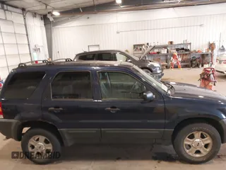 2004 Ford Escape XLT with VIN 1FMYU93134KB36712, listed as a IAAI auction lot 42412101 with 232,340 mi miles and . Bid and sale history available at DreamBid. Image 13.
