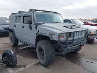 2003 Hummer H2 with VIN 5GRGN23U13H128617, listed as a IAAI auction lot 41494349 with 135,295 mi miles. Bid and sale history available at carsss.com. Image 1.
