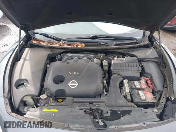 2013 Nissan Maxima SV z VIN 1N4AA5AP7DC814845, wystawiony jako IAAI lot #41758456 z przebiegiem 139 556 mil mil oraz . Historia ofert i sprzedaży dostępna na DreamBid. Obrazek 10.