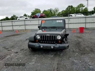 2012 Jeep Wrangler Unlimited Sport z VIN 1C4BJWDG9CL102626, wystawiony jako Copart lot #58421455 z przebiegiem 128 421 mil mil oraz Szkoda całkowita • Salvage title. Historia ofert i sprzedaży dostępna na DreamBid. Obrazek 14.