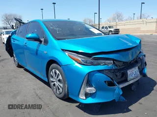 2021 Toyota Prius LE with VIN JTDKAMFP7M3169633, listed as a IAAI auction lot 41986170 with 55,925 mi miles and . Bid and sale history available at DreamBid. Image 1.