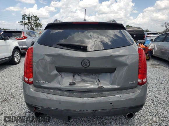 2014 Cadillac SRX Premium Collection z VIN 3GYFNGE30ES627895, wystawiony jako Copart lot #58605985 z przebiegiem 49 300 mil mil oraz Szkoda całkowita • Salvage title. Historia ofert i sprzedaży dostępna na DreamBid. Obrazek 6.