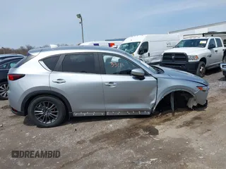2020 Mazda CX-5 Touring with VIN JM3KFACM9L0785464, listed as a IAAI auction lot 42023311 with 90,062 mi miles and . Bid and sale history available at DreamBid. Image 13.
