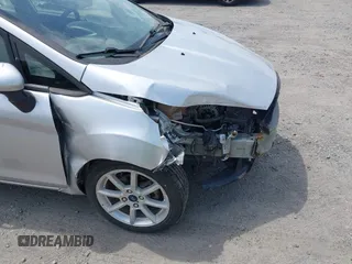 2019 Ford Fiesta SE z VIN 3FADP4EJ9KM107124, wystawiony jako IAAI lot #42067464 z przebiegiem 89 076 mil mil oraz . Historia ofert i sprzedaży dostępna na DreamBid. Obrazek 19.