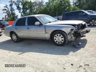 2003 Mercury Grand Marquis LS Premium with VIN 2MEHM75W63X697725, listed as a Copart auction lot 54485505 with 129,194 mi miles and Salvage Title. Bid and sale history available at DreamBid. Image 4.