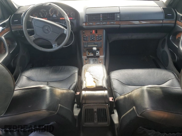 1995 Mercedes-Benz S with VIN WDBGA43E9SA233994, listed as a Copart auction lot 65867264 with 655,674 mi miles and Salvage Title. Bid and sale history available at DreamBid. Image 8.