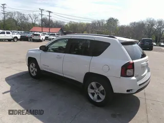 2014 Jeep Compass Sport with VIN 1C4NJDBB2ED774078, listed as a IAAI auction lot 42038110 with 104,606 mi miles. Bid and sale history available at carsss.com. Image 3.