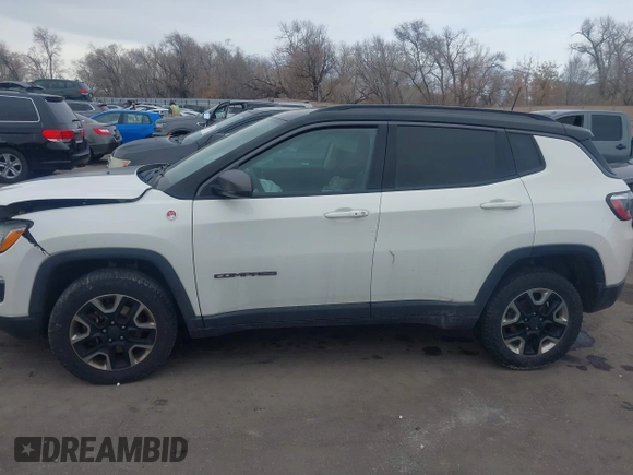 2018 Jeep Compass Trailhawk with VIN 3C4NJDDB9JT174899, listed as a IAAI auction lot 41635784 with 124,656 mi miles and . Bid and sale history available at DreamBid. Image 13.