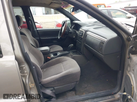 2001 Jeep Grand Cherokee Laredo z VIN 1J4GW48S01C658017, wystawiony jako IAAI lot #42160310 z przebiegiem 220 309 mil mil oraz . Historia ofert i sprzedaży dostępna na DreamBid. Obrazek 5.