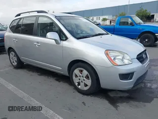 2009 Kia Rondo LX with VIN KNAFG528497222225, listed as a IAAI auction lot 42108192 with 113,040 mi miles. Bid and sale history available at carsss.com. Image 1.