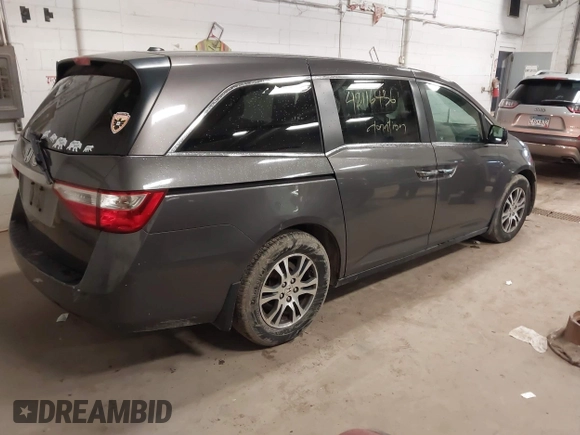 2011 Honda Odyssey EX-L with VIN 5FNRL5H67BB049446, listed as a IAAI auction lot 42116436 with 197,667 mi miles and . Bid and sale history available at carsss.com. Image 4.
