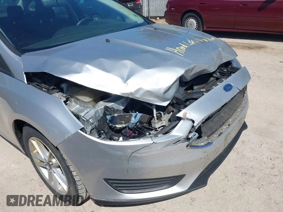 2017 Ford Focus SE z VIN 1FADP3F21HL237412, wystawiony jako IAAI lot #42188886 z przebiegiem 148 355 mil mil oraz . Historia ofert i sprzedaży dostępna na DreamBid. Obrazek 12.